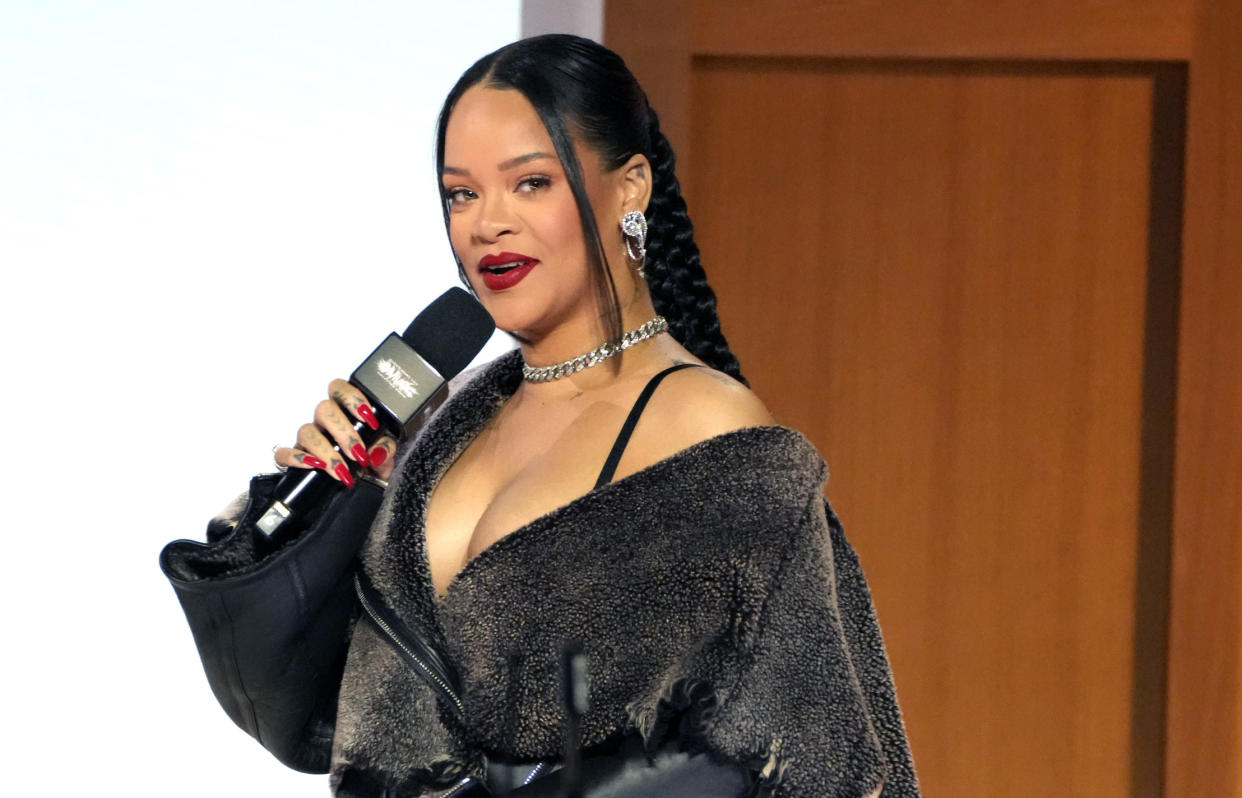 Rihanna poses during a Super Bowl half-time show press conference