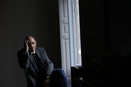 Spanish Examining Magistrate Elpidio Jose Silva, 53, poses for a photo in Madrid December 27, 2013. REUTERS/Susana Vera