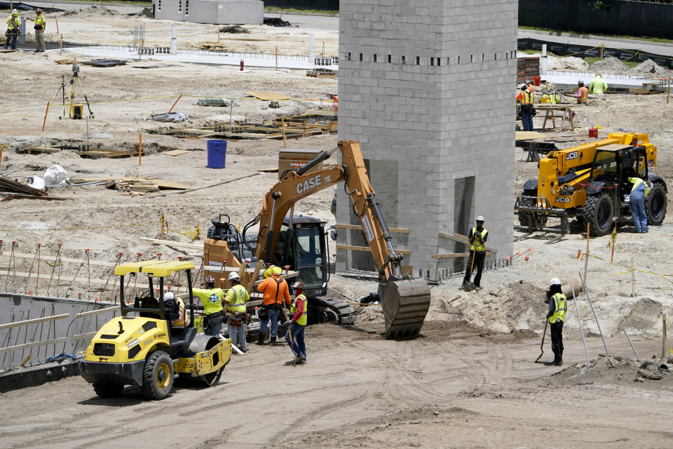 Workers continue construction of the Jacksonville Jaguars Sports Performance Center, Tuesday, May 31, 2022, in Jacksonville, Fla. The center, scheduled to be completed in 2023, includes nearly 130,000 square feet of space that will house new meeting rooms, weight rooms, locker rooms and practice fields. (AP Photo/John Raoux)