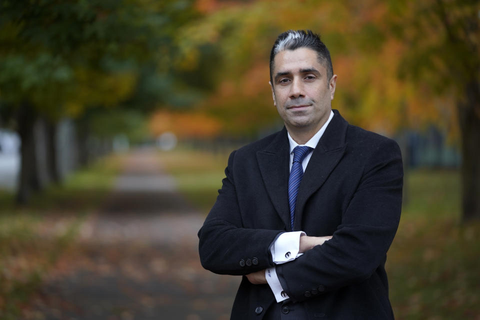 Mohammad Hamoudi, a federal public defender, poses for a photo Wednesday, Oct. 13, 2021 in Seattle. Auburn Police Officer Jeffrey Nelson has been charged in the shooting death of Jesse Sarey, and has been investigated in more than 60 use-of-force cases since 2012, but he wasn't placed on the King County prosecuting attorney's "potential impeachment disclosure" list, or Brady List, which flags officers whose credibility is in question due to misconduct, until after being charge in Sarey's death. Hamoudi said given Nelson's history, all his cases should be reviewed. And he hopes his story will encourage prosecutors to track excessive force cases involving other police officers. (AP Photo/Ted S. Warren)
