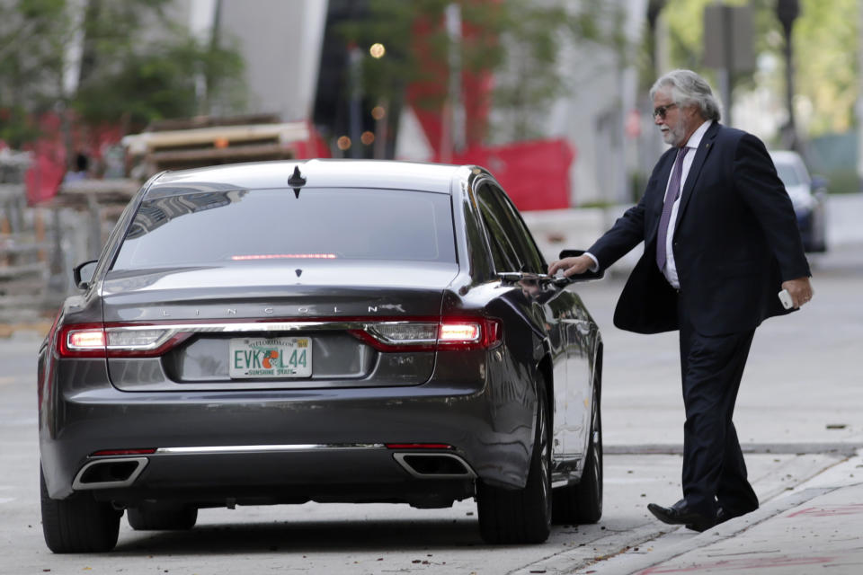 Carnival Corp. Chairman Micky Arison leaves federal court, Monday, June 3, 2019, in Miami. Carnival Corp. reached a settlement with federal prosecutors in which the world's largest cruise line agreed to pay a $20 million penalty for its ships continuing to pollute the ocean despite promising years ago to stop. (AP Photo/Lynne Sladky)