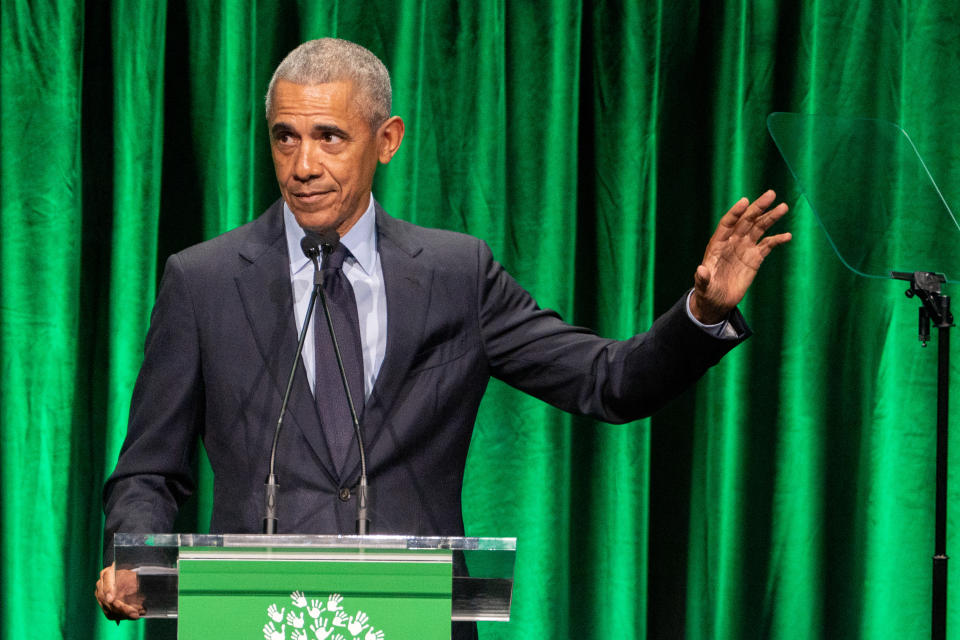 Former President Barack Obama pauses during a speech at a Sandy Hook Promise event.