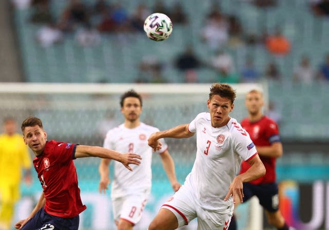 Czech Republic’s Lukas Masopust (left) challenges for the ball with Denmark’s Jannik Vestergaard