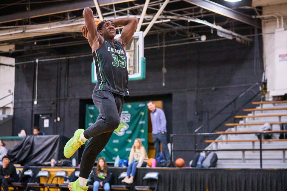 Jan 23, 2023; Phoenix, AZ, USA; Phoenix Christian Cougars point guard Tommy Randolph goes to dunk during practice at the Phoenix Christian High School gym on Monday, Jan. 23, 2023. Mandatory Credit: Alex Gould/The Republic