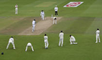 England's James Anderson, top second right, reacts after teammate Zak Crawley, second right, dropped a catch of Pakistan's Mohammad Abbas, center, during the third day of the third cricket Test match between England and Pakistan, at the Ageas Bowl in Southampton, England, Sunday, Aug. 23, 2020. (Mike Hewitt/Pool via AP)