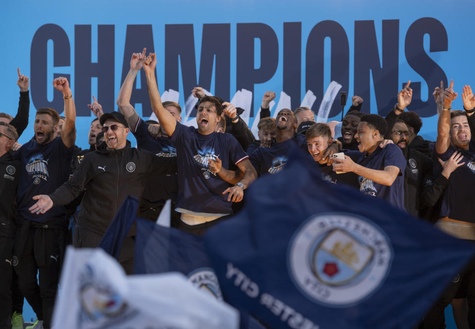 MANCHESTER, ENGLAND - MAY 23: Manchester City players celebrate their EPL title with the fans during the Manchester City FC Victory Parade on May 23, 2022 in Manchester, England. (Photo by Visionhaus/Getty Images) *** Local Caption ***