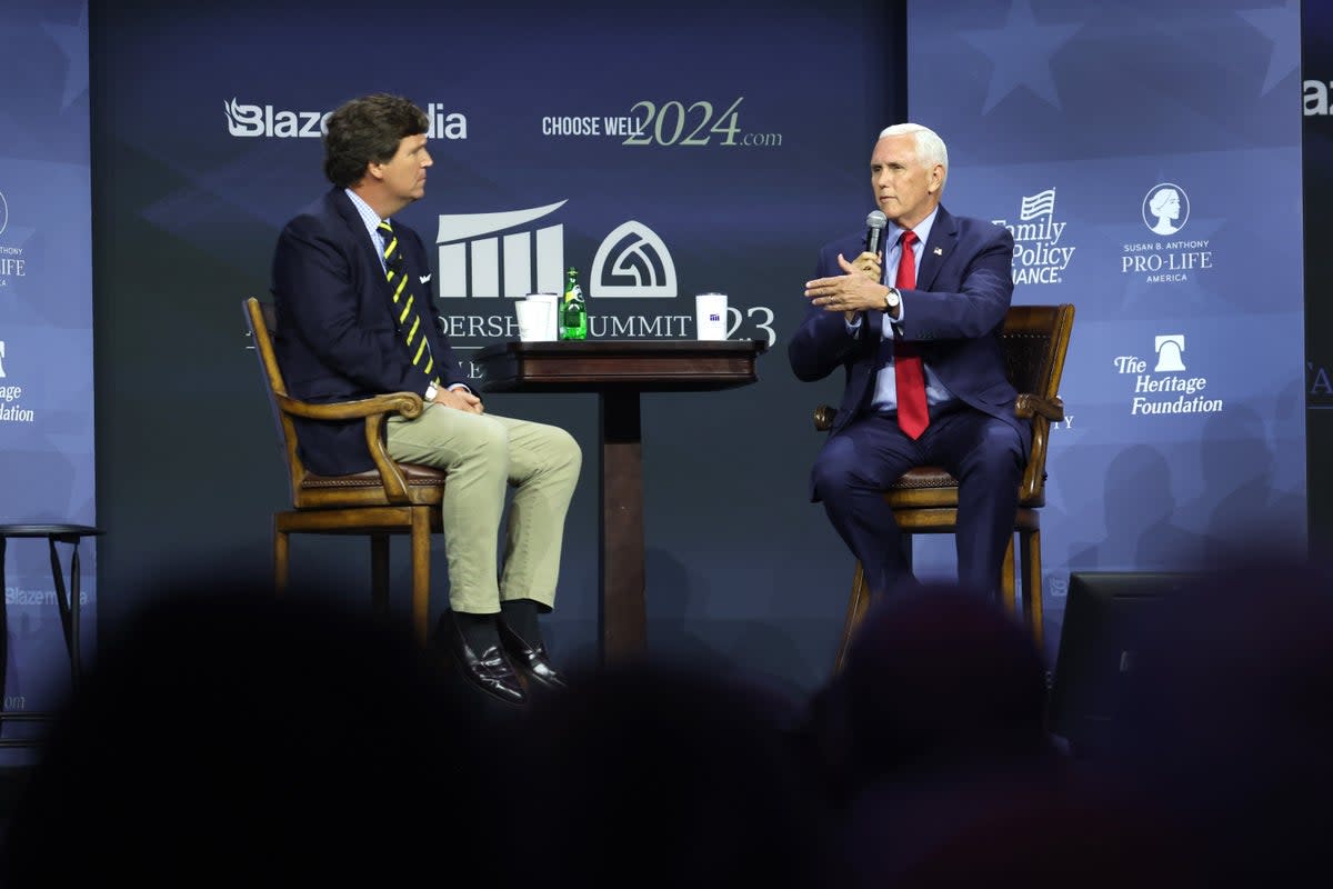 Mike Pence fields questions from former Fox News host Tucker Carlson at the at the Family Leadership Summit in Des Moines, Iowa (Getty Images)