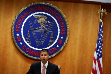 FILE PHOTO: Chairman Ajit Pai speaks ahead of the vote on the repeal of so called net neutrality rules at the Federal Communications Commission in Washington, U.S., December 14, 2017. REUTERS/Aaron P. Bernstein