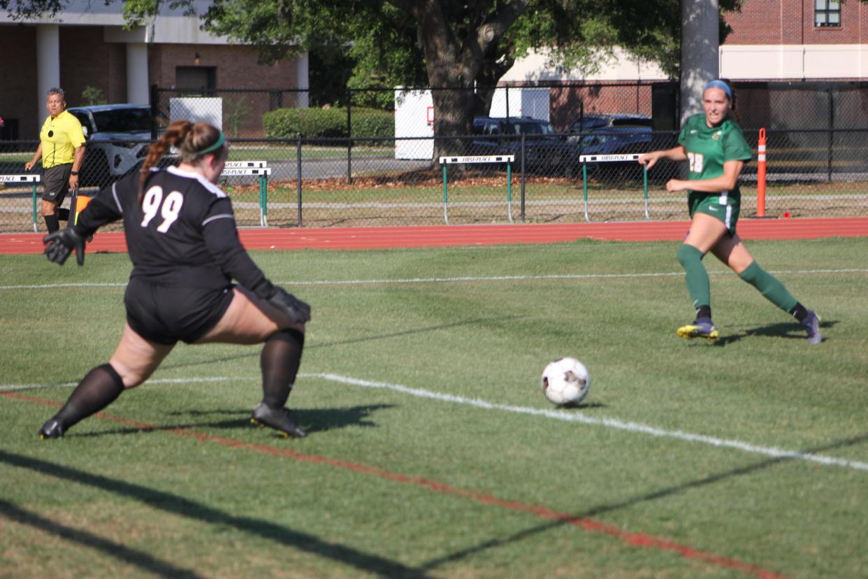 Savannah Country Day's AC Davis delivers a goal in a win playoff win over Morgan County on April 23, 2024.