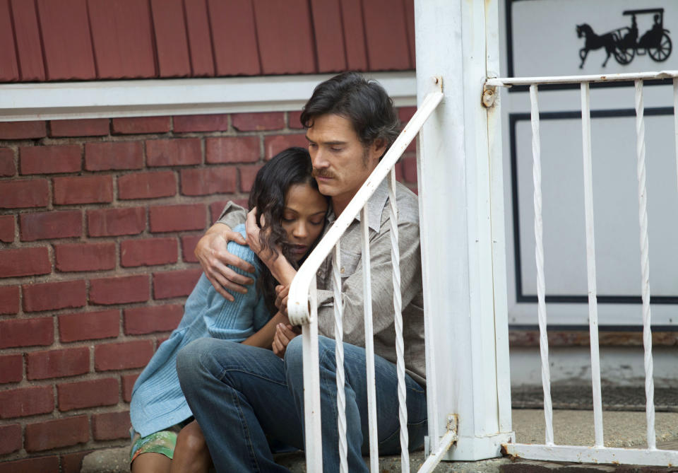 This image released by Roadside Attractions shows Zoe Saldana, left, and Billy Crudup in a scene from "Blood Ties." (AP Photo/Roadside Attractions)