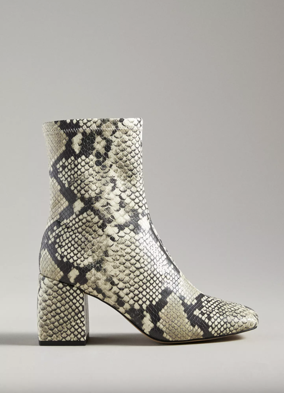 Silent D Carina Heeled Ankle Boots in white and black snakeskin (Photo via Anthropologie)