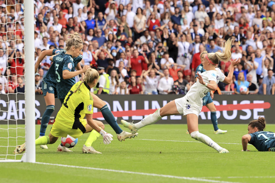 England's Chloe Kelly scores her side's second goal during the Women's Euro 2022 final soccer match between England and Germany at Wembley stadium in London, Sunday, July 31, 2022. (AP Photo/Leila Coker)