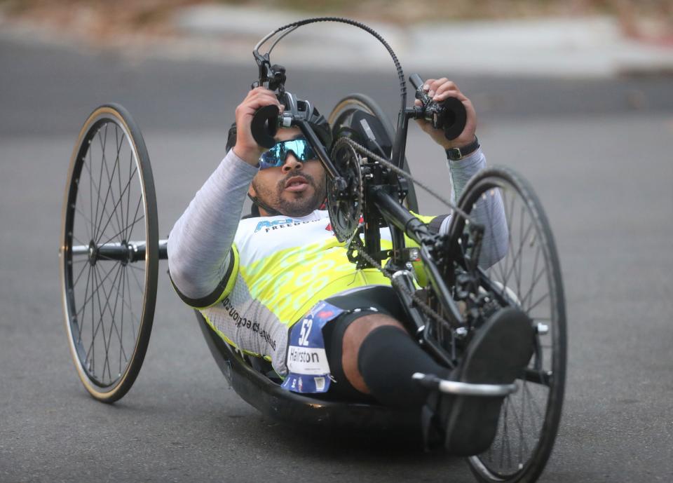 Competing in the MPVA Disabilities division Andrew Hairston rides down Seminole during the 45th Detroit Free Press Marathon in Detroit on Sunday, October 16, 2022.