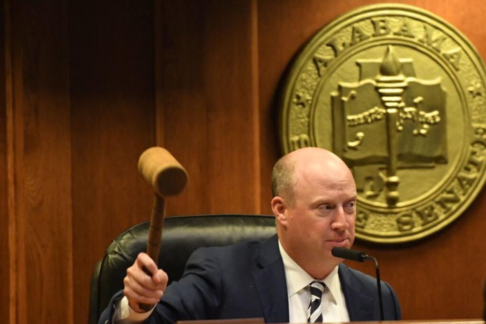 A man holding a gavel