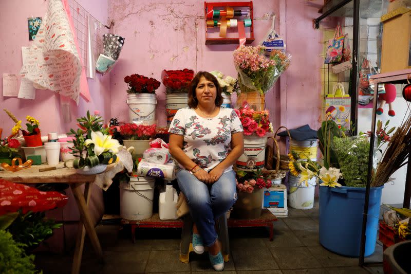 Maria Trinidad Perez poses inside a florist shop in Ecatepec, State of Mexico