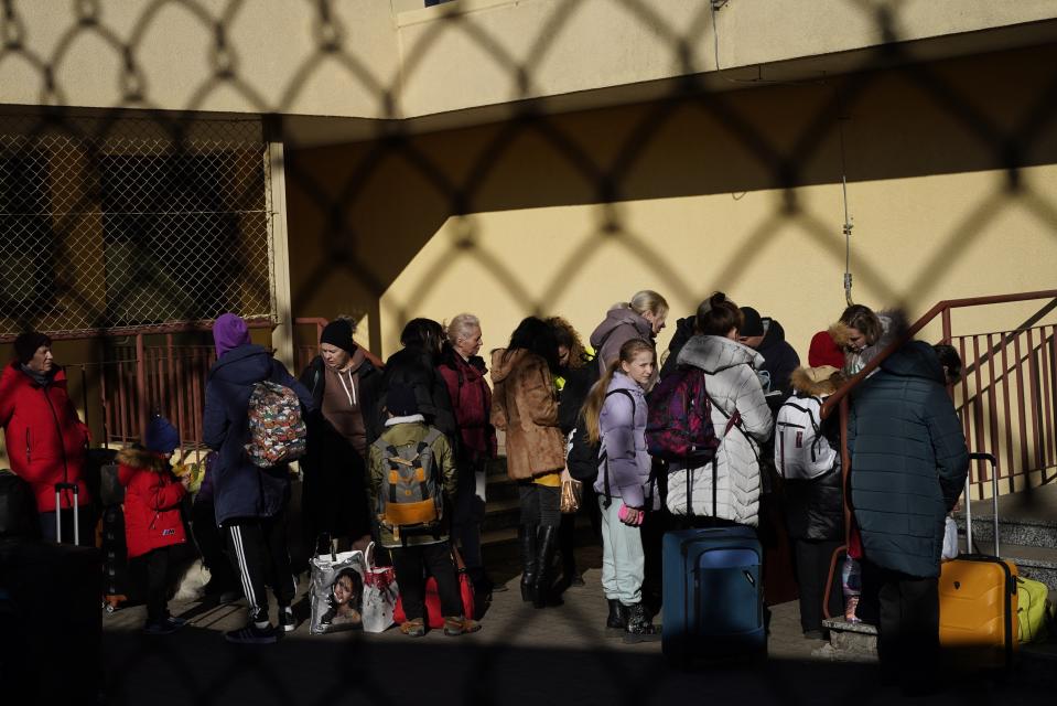 Ukrainian refugees arrive from Lviv to Przemysl train station, southeastern Poland, on Friday, March 11, 2022. Thousands of people have been killed and more than 2.3 million have fled the country since Russian troops crossed into Ukraine on Feb. 24. (AP Photo/Daniel Cole)