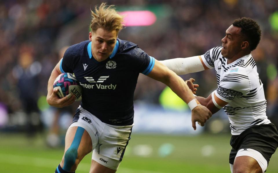 November 5, 2022 Scotland's Duhan van der Merwe runs through to score their third try as Fiji's Sireli Maqala attempts to tackle - Russell Cheyne/Reuters