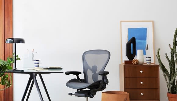 Herman Miller Aeron chair in retro office setting.