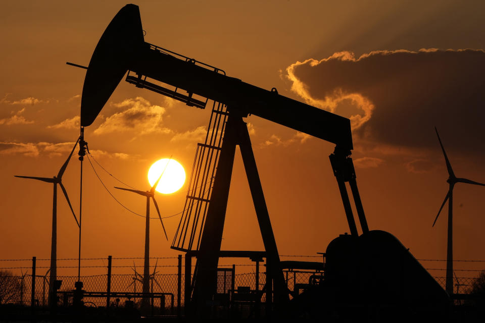 FILE - A pumpjack extracts crude at an oil field in Emlichheim, Germany, March 18, 2022. Wildfires, floods and soaring temperatures have made climate change real to many Americans. Yet a sizeable number continue to dismiss the scientific consensus that human activity is to blame. That's in part because of a decades-long campaign by fossil fuel companies to muddy the facts and promote fringe explanations. (AP Photo/Martin Meissner, File)