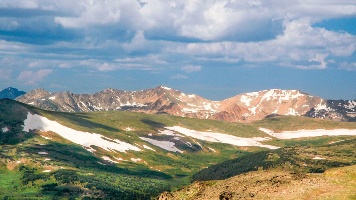 Vita from trail Ridge Road in Rocky Mountain National Park showing meadows and snow capped peaks