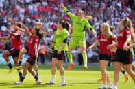 Manchester United goalkeeper Mary Earps, center, and her teammates celebrate at the end of the Women's FA Cup final soccer match between Manchester United and Tottenham Hotspur at Wembley Stadium in London, Sunday, May 12, 2024. Manchester United won 4-0. (AP Photo/Kirsty Wigglesworth)