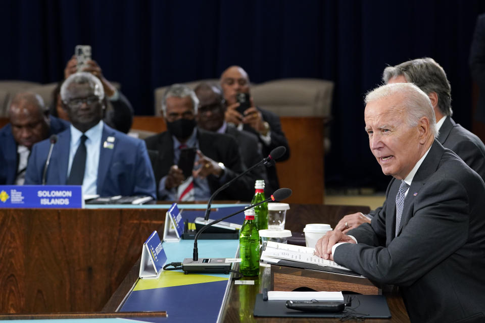 FILE - President Joe Biden speaks during the first U.S.-Pacific Island Country Summit at the State Department in Washington, Sept. 29, 2022. Prime Minister of the Solomon Islands Manasseh Sogavare listens at left. The Biden administration is plowing ahead with plans to re-open the U.S. embassy in the Solomon Islands in a bid to counter China’s increasing assertiveness in the Pacific. (AP Photo/Susan Walsh, File)