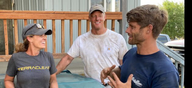 TerraClear Marketing Director Heidi Lindsley, CEO Brent Frei and President Trevor Thompson get together after picking about 30,000 rocks during the company’s first customer service job. (TerraClear Photo)