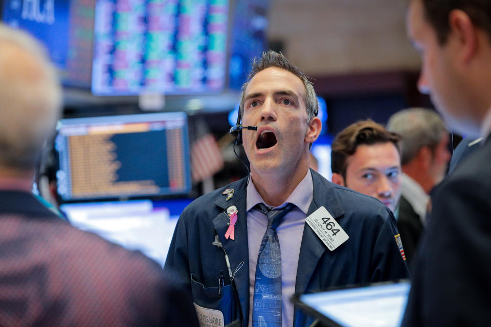 Traders work on the floor at the New York Stock Exchange (NYSE) in New York, U.S., July 31, 2019. REUTERS/Brendan McDermid