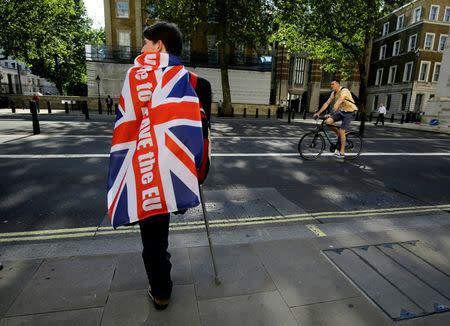 A vote leave supporter stands with the aid of a crutch outside Downing Street in London, Britain June 24, 2016 after Britain voted to leave the European Union. REUTERS/Kevin Coombs