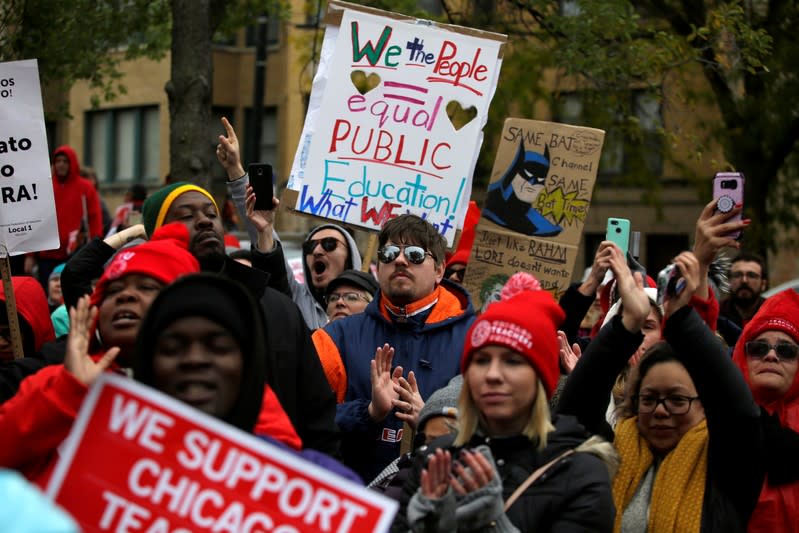 Striking teachers on picket cheer Democratic presidential candidate Senator Elizabeth Warren in Chicago