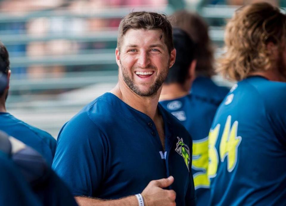 Tim Tebow jokes with his teammates during a game with the Columbia Fireflies.