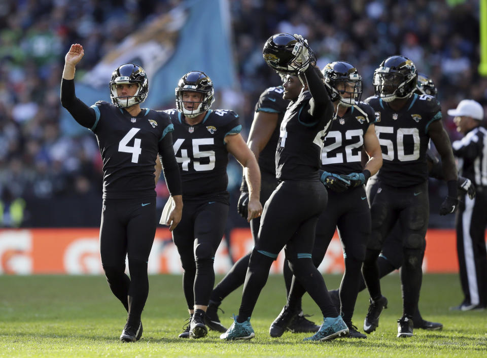 Jacksonville Jaguars kicker Josh Lambo (4) celebrates after scoring a field goal during the first half of an NFL football game against Philadelphia Eagles at Wembley stadium in London, Sunday, Oct. 28, 2018. (AP Photo/Tim Ireland)