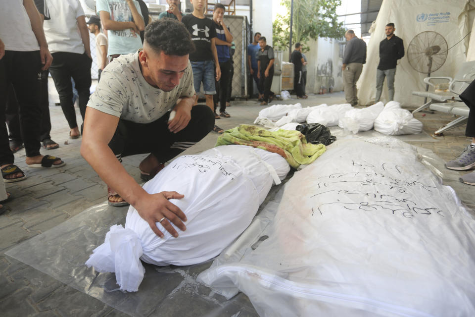 Palestinians mourn relatives killed in the Israeli bombardment of the Gaza Strip in Rafah, Monday, Oct 30, 2023. (AP Photo/Hatem Ali)