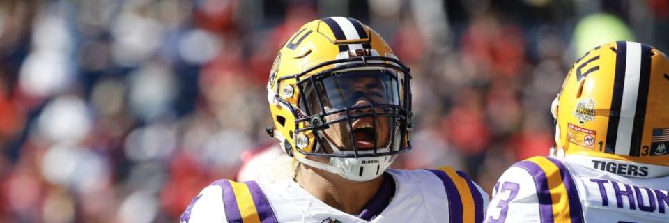 Dec 31, 2016; Orlando, FL, USA; LSU Tigers linebacker Duke Riley (4) reacts with defensive back Dwayne Thomas (13) against the Louisville Cardinals during the second half at Camping World Stadium. LSU Tigers defeated the Louisville Cardinals 29-9. Mandatory Credit: Kim Klement-USA TODAY Sports