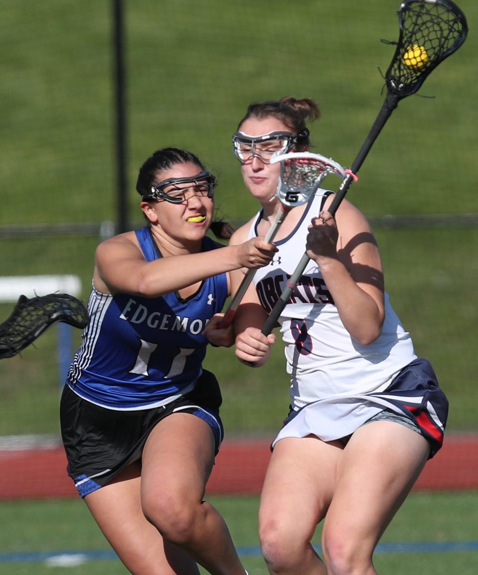 Edgemont's Iliana Dimopoulos (11) puts pressure on Byram Hills' Anastasia Byrnes (9) during girls lacrosse action at Byram Hills High School in Armonk May 17, 2023. Byram Hills won the game 16-6.