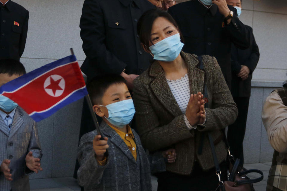 People watch a dancing party of youth and students in celebration of the 110th birth anniversary of its late founder Kim Il Sung at Kim Il Sung Square in Pyongyang, North Korea Friday, April 15, 2022. (AP Photo/Jon Chol Jin)