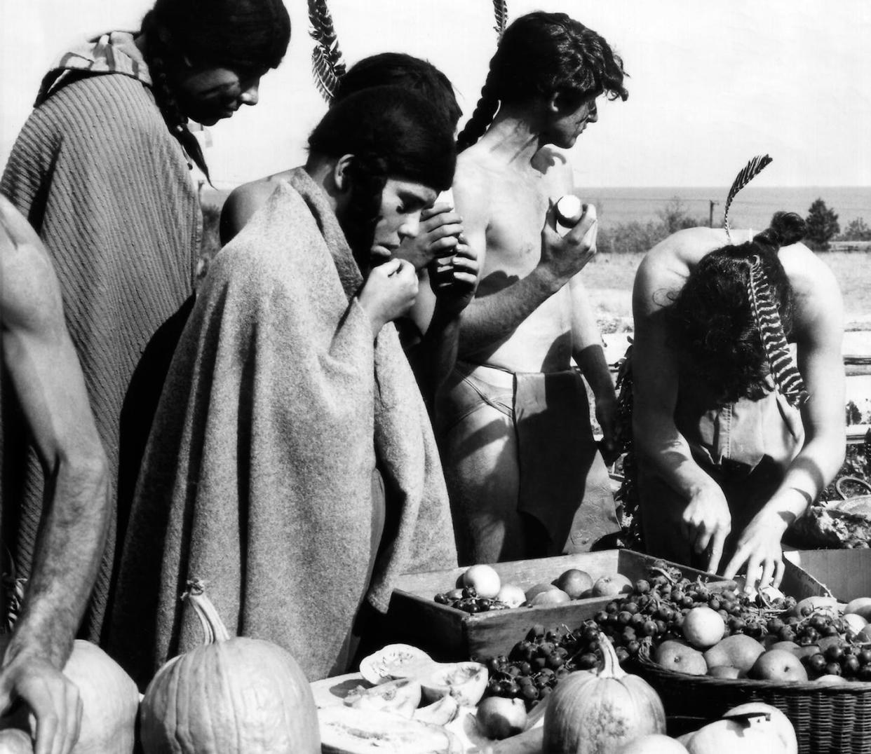 Native Americans depicted at the first Thanksgiving feast, in a 1960 film about the Pilgrims’ first year in America. <a href="https://newsroom.ap.org/detail/MoviesEducationalFilms/6e19fb0444d146fdb6f09520e734f7a7/photo?Query=thanksgiving%20dinner%20native%20americans&mediaType=photo&sortBy=&dateRange=Anytime&totalCount=546&currentItemNo=9&vs=true&vs=true" rel="nofollow noopener" target="_blank" data-ylk="slk:AP Photo;elm:context_link;itc:0;sec:content-canvas" class="link ">AP Photo</a>