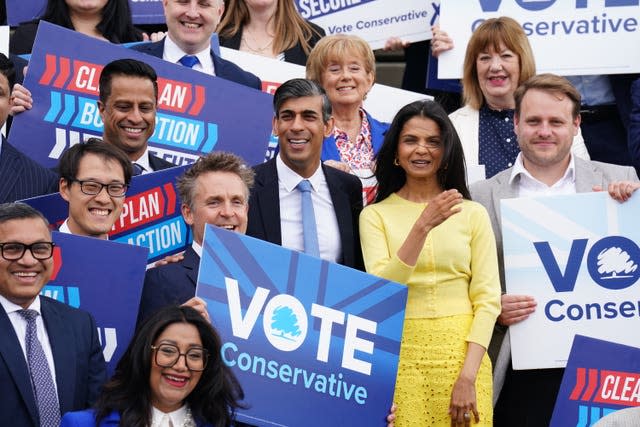 Rishi Sunak and his wife Akshata Murty surrounded by Tory supporters at the party's manifesto launch