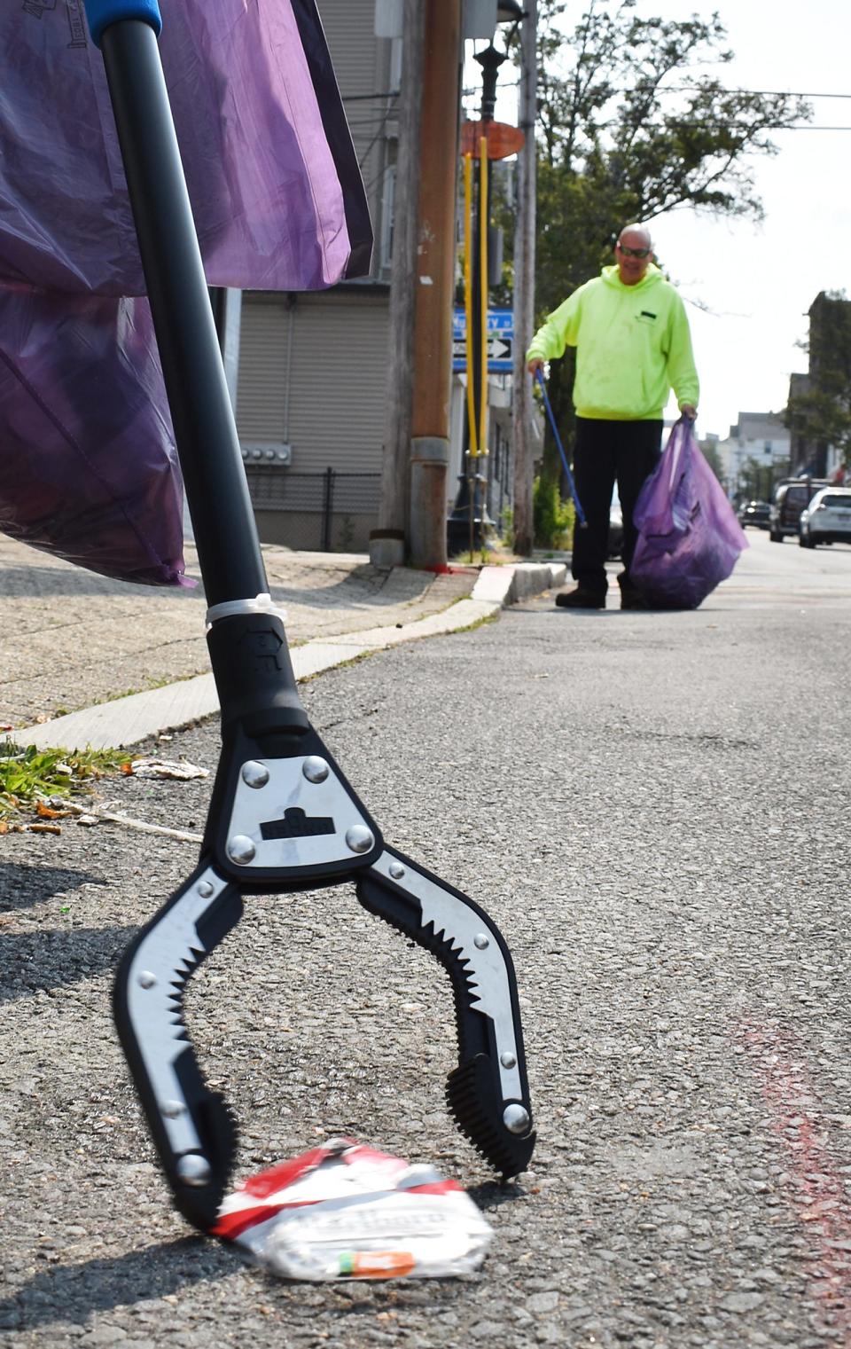 Bill Wrightington cleans up Columbia Street Wednesday in a pilot program through the city of Fall River and the Bristol County Training Consortium.