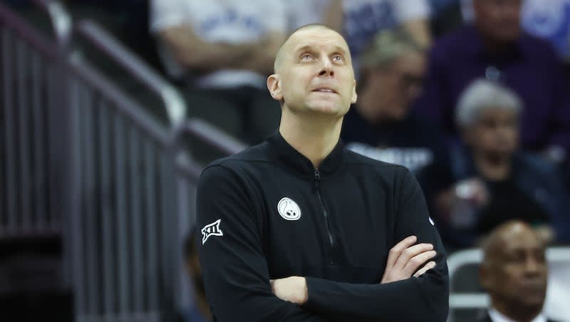 Brigham Young Cougars head coach Mark Pope looks at the replay against Texas Tech during the Big 12 conference championship in Kansas City, Mo., on Thursday, March 14, 2024.