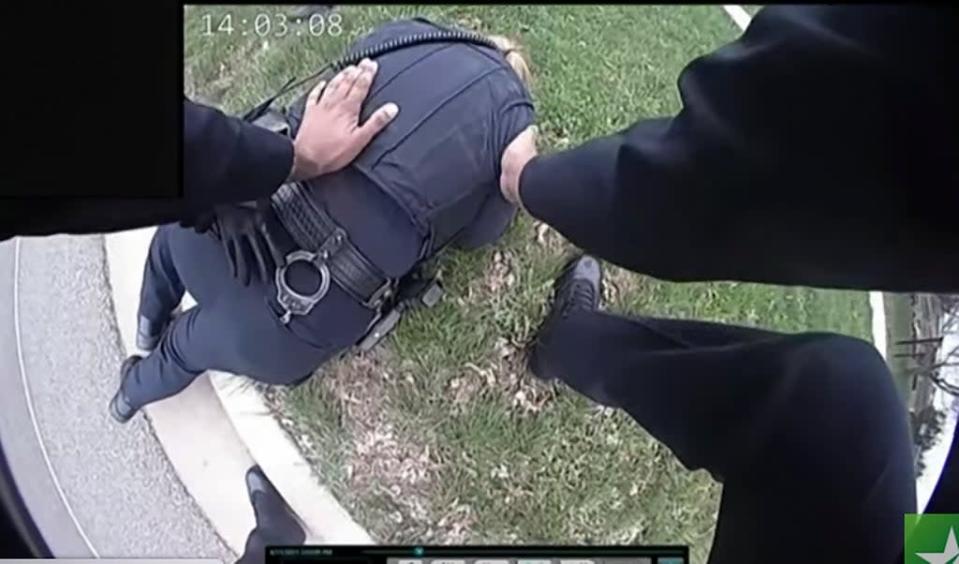 Kim Potter is seen in bodycam lying on the ground after she shot Daunte Wright (AP)