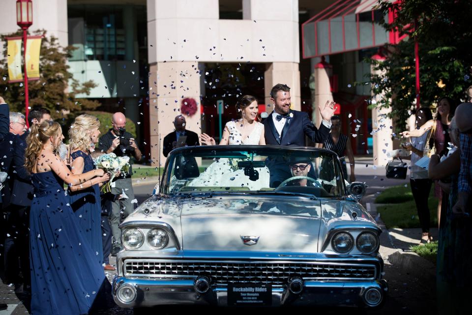 Wedding guests shower Lindsey Wilkerson and Joel Alsup in heart shaped confetti following their wedding at St. Jude Children's Research Hospital.