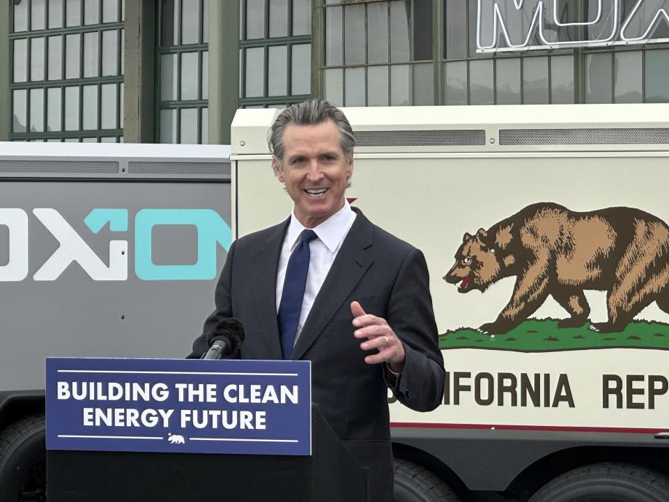 California Gov. Gavin Newsom speaks during a news conference, Thursday, May 25, 2023, in Richmond, California. Newsom updated his plan for the state to move away from fossil fuels. State regulators say California is unlikely to have an electricity shortage this summer. (AP Photo/Adam Beam)