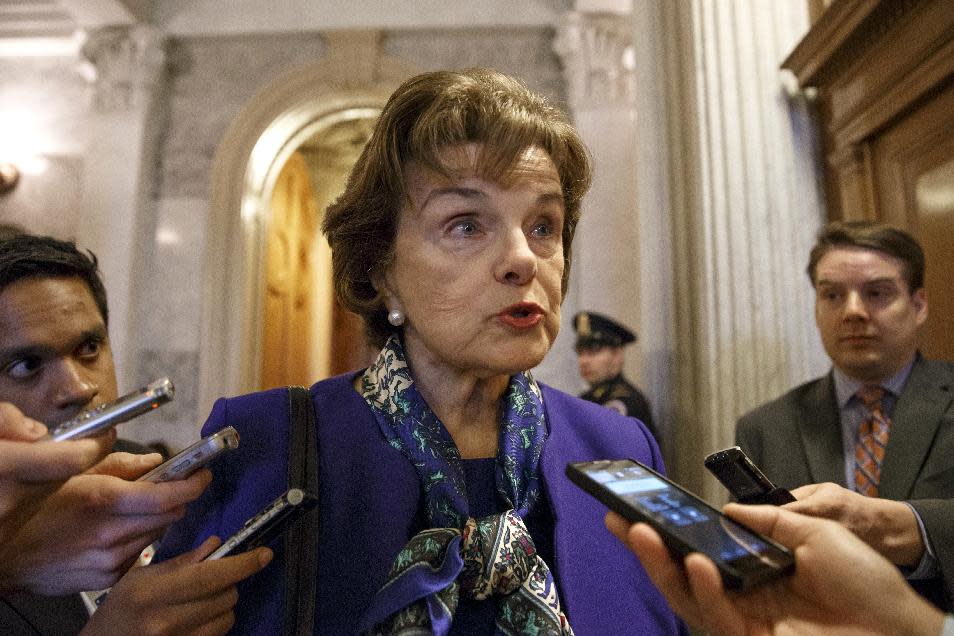 FILE - This March 11, 2014 file photo shows Senate Intelligence Committee Chair Sen. Dianne Feinstein, D-Calif. speaking to reporters as she leaves the Senate chamber on Capitol Hill in Washington. A Senate intelligence committee vote next week to release key sections of a voluminous, still-secret report on terror interrogations would start a declassification process that could severely test the already strained relationship between lawmakers and the CIA, and force President Barack Obama to step into the fray. (AP Photo/J. Scott Applewhite, File)