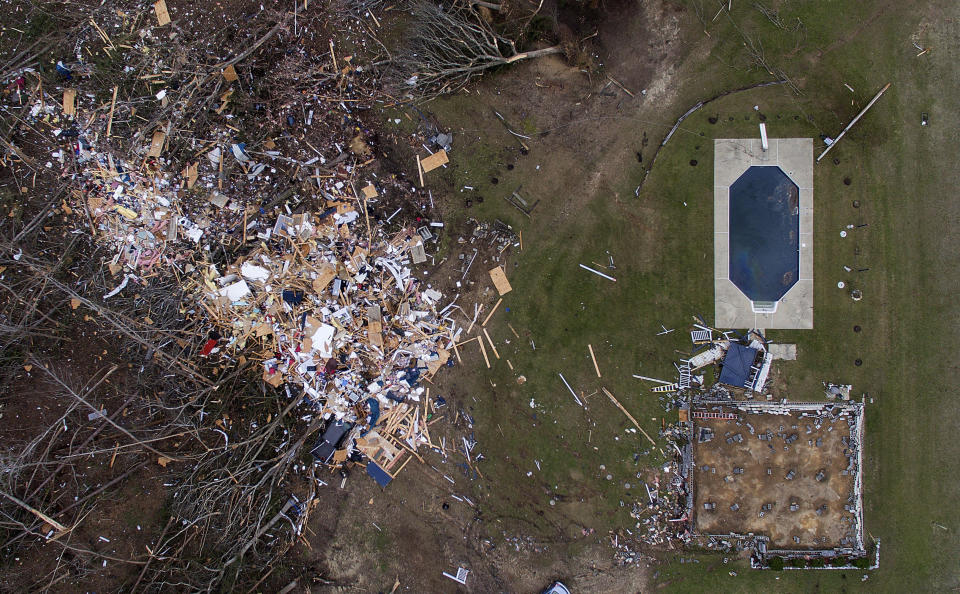 Debris from a home litters a yard the day after a tornado blew it off its foundation, lower right, in Beauregard, Ala., March 4, 2019. (Photo: David Goldman/AP)