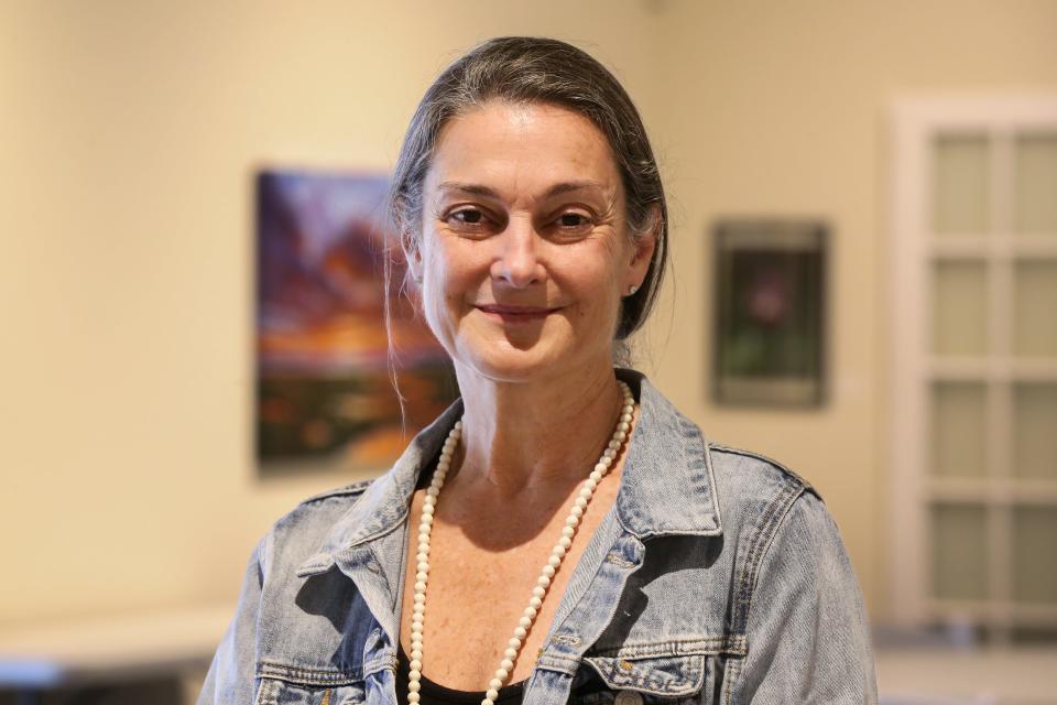 Dianna Bluntzer Sherman, executive director of the Art Center of Corpus Christi, poses inside the gallery Thursday, Feb. 22, 2024.