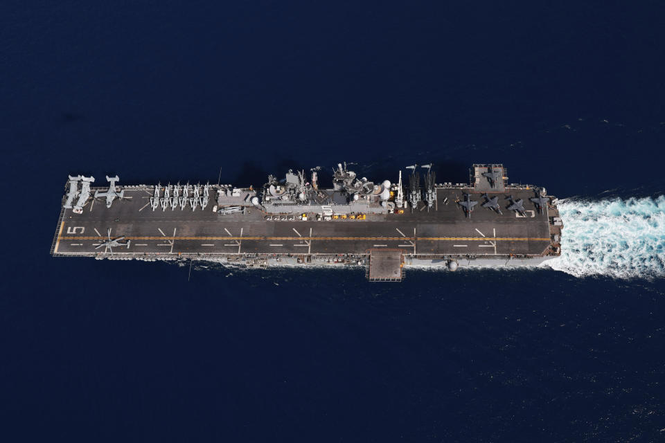 In this photo released by the U.S. Navy, the amphibious assault ship USS Bataan travels through the Red Sea, Tuesday, Aug. 8, 2023. Western-backed maritime forces in the Middle East on Saturday, Aug. 12, warned shippers traveling through the strategic Strait of Hormuz to stay as far away from Iranian territorial waters as possible to avoid being seized, a stark advisory amid heightened tensions between Iran and the U.S. (Mass Communication Specialist 3rd Class Riley Gasdia/U.S. Navy, via AP)