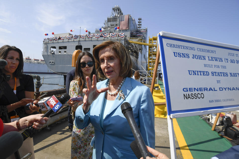 Speaker of the House Nancy Pelosi talks to the media in front of USNS John Lewis after a christening ceremony Saturday July 17, 2021, in San Diego. (AP Photo/Denis Poroy)