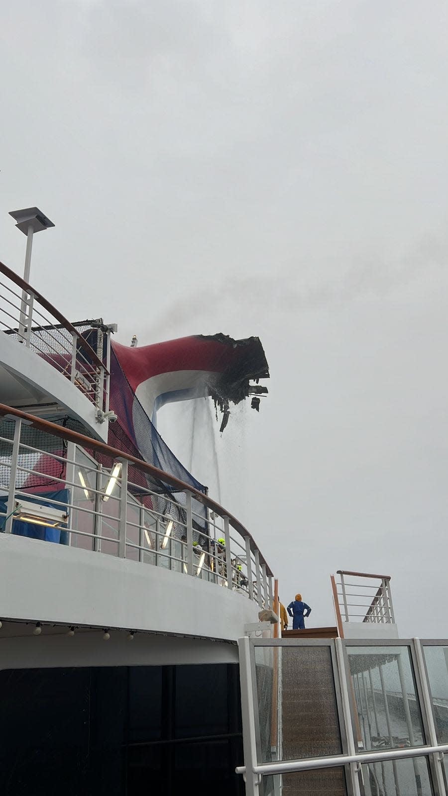 This photo shows damage to the Carnival Freedom cruise ship's exhaust funnel caused by a fire while it was at sea Saturday.
