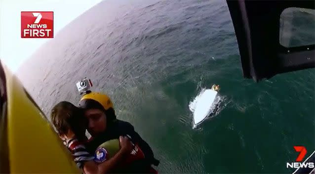 Westpac Lifesaver rescuer Gillian Howard winches Joe up from a capsized boat off North Stradbroke Island. Source: 7 News